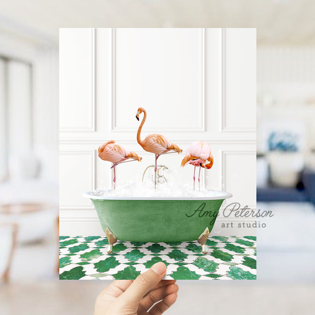 a person holding up a card with flamingos in a bathtub