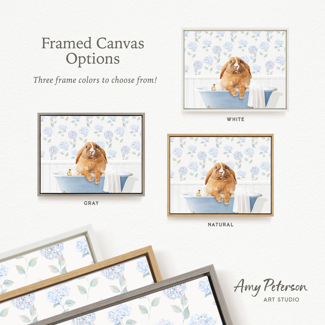 The image is a framed canvas option featuring a brown dog sitting in a blue bathtub, surrounded by blue flowers. There are three frame colors to choose from: white, gray, and natural. The image is from Amy Peterson's Art Studio.