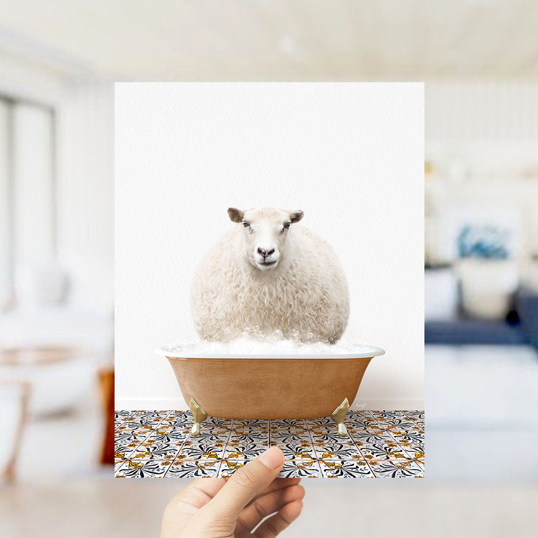 A fluffy white sheep is sitting in a brown bathtub filled with bubbles, with a hand holding up the image to the camera.