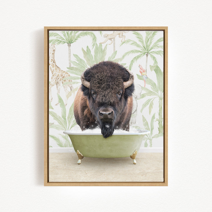 A buffalo with a black mane and horns is sitting in a green bathtub, surrounded by tropical foliage and animals.