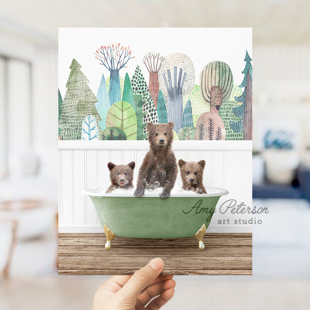 a person holding up a card with three bears in a bathtub