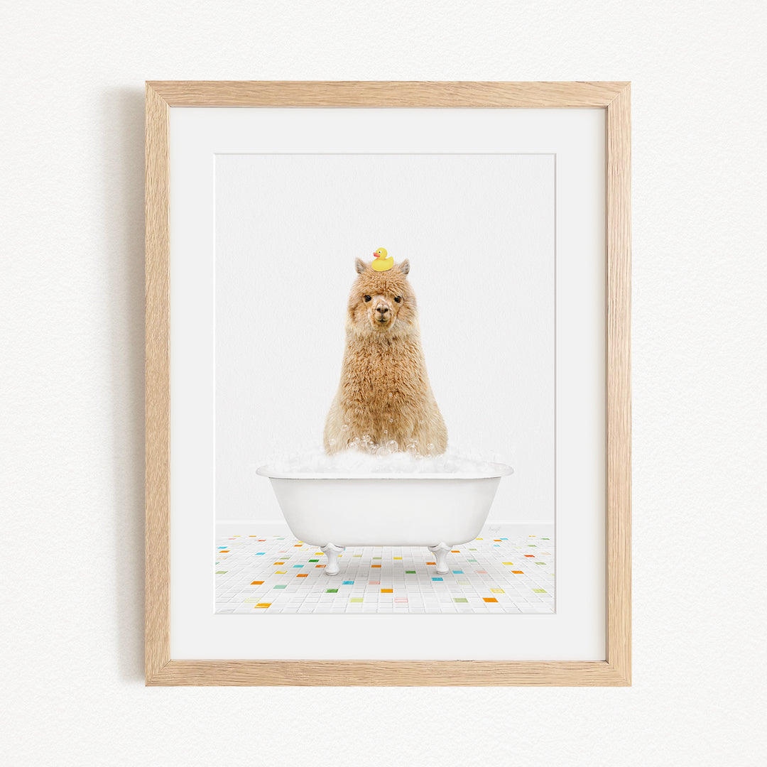 A fluffy brown dog sitting in a white bathtub filled with bubbles, wearing a yellow hat.