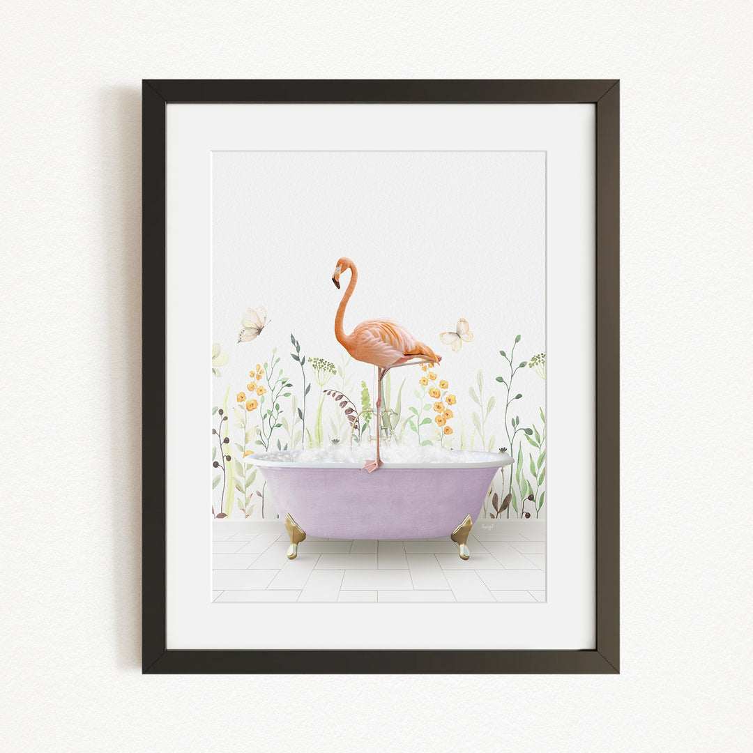 A framed illustration depicting a pink flamingo standing on a purple bathtub filled with bubbles, surrounded by flowers and butterflies.