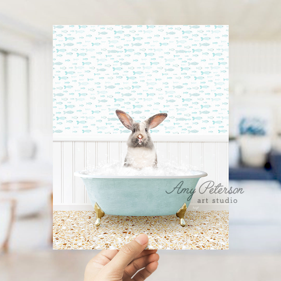 a person holding up a card with a picture of a rabbit in a bathtub