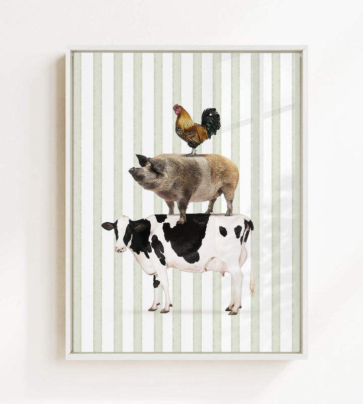 A framed image depicting a cow, pig, and rooster standing on top of each other.