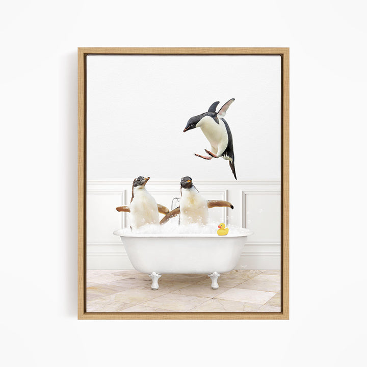 A framed image depicting three penguins sitting in a bathtub, with one penguin flying towards the others.