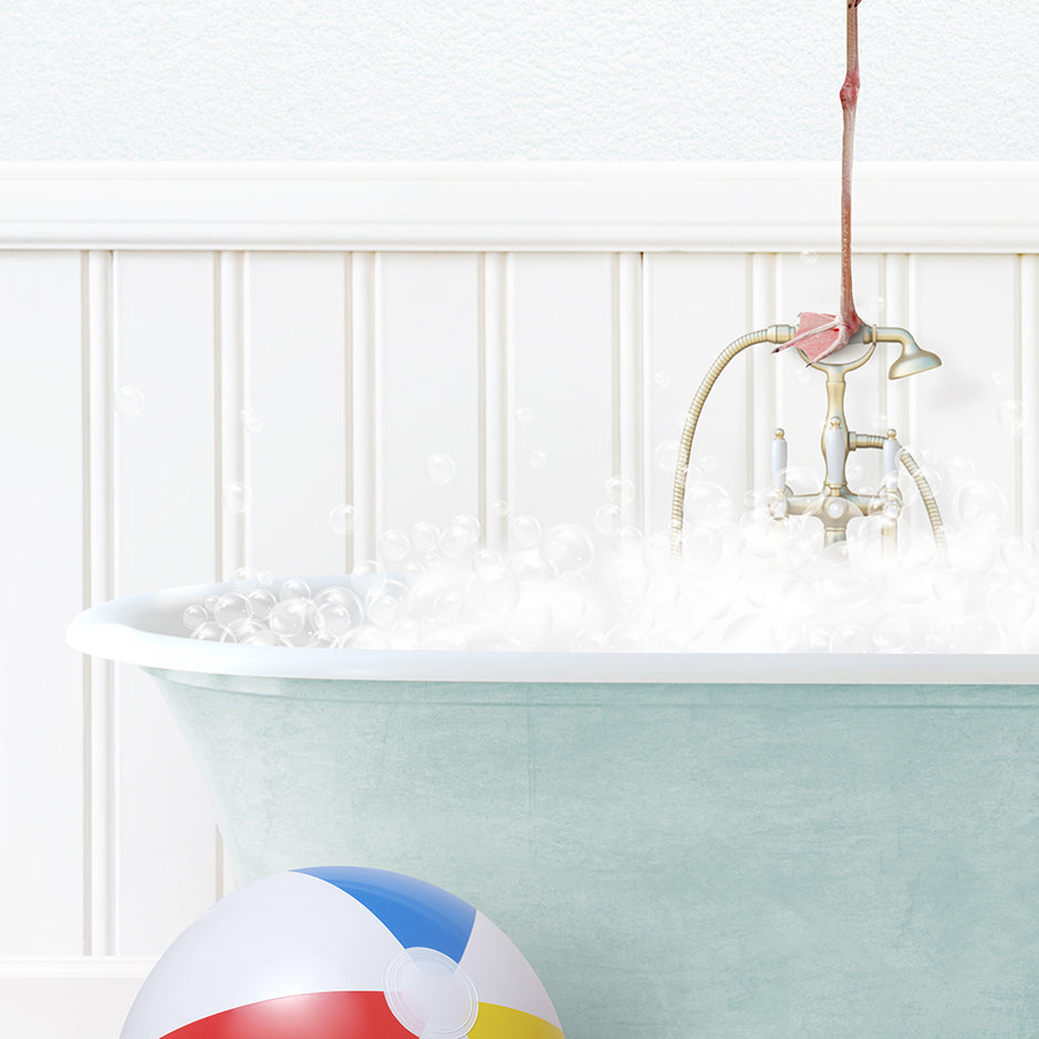 a bathtub filled with bubbles and a beach ball