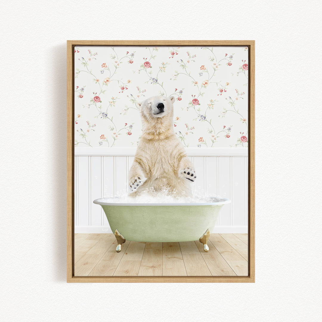 A polar bear is sitting in a green bathtub filled with water, surrounded by a floral wallpaper.