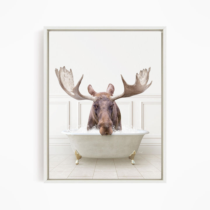 A moose with large antlers is sitting in a bathtub filled with water, creating a whimsical and humorous scene.