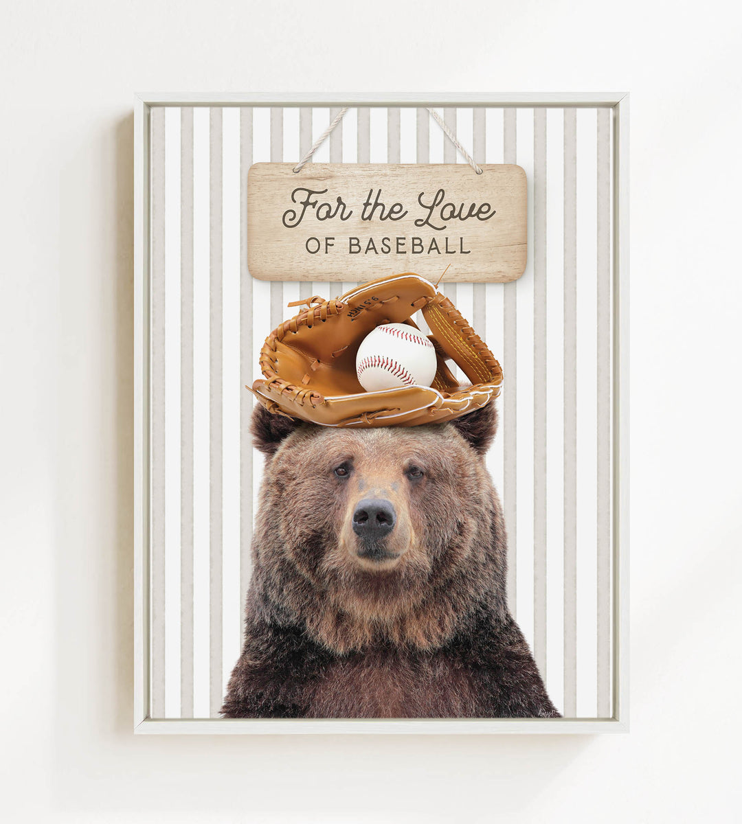 A brown bear wearing a baseball glove and ball sits in front of a wooden sign that says "For the Love of Baseball".