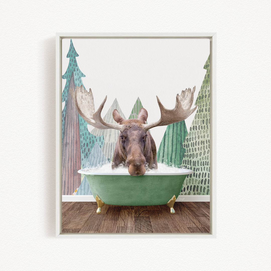 A moose with large antlers is sitting in a green bathtub, surrounded by a forest scene with trees and a snowy landscape.