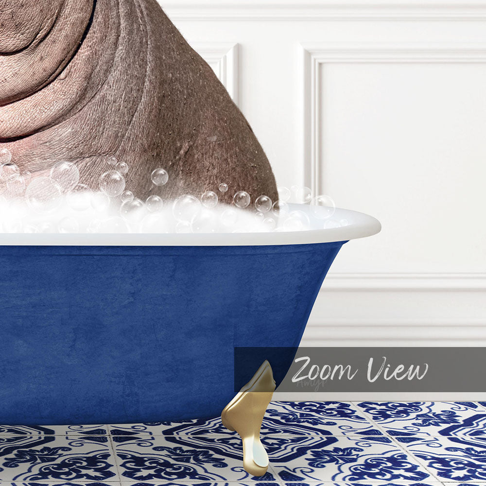 A close-up of a blue bathtub filled with bubbles, with a gold faucet and a gold bathtub stopper.