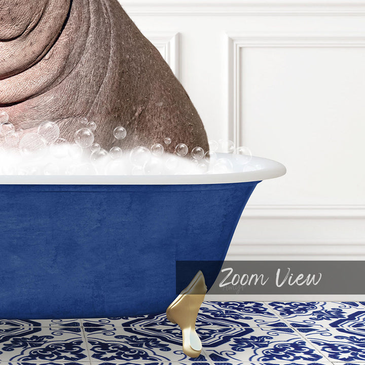 A close-up of a blue bathtub filled with bubbles, with a gold faucet and a gold bathtub stopper.