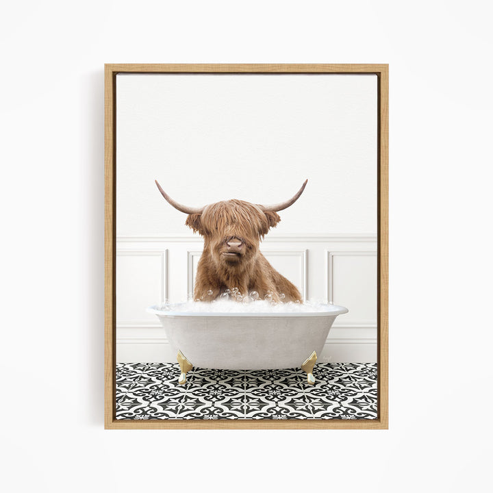 A brown cow with long horns is sitting in a white bathtub filled with water, creating a whimsical and amusing scene.