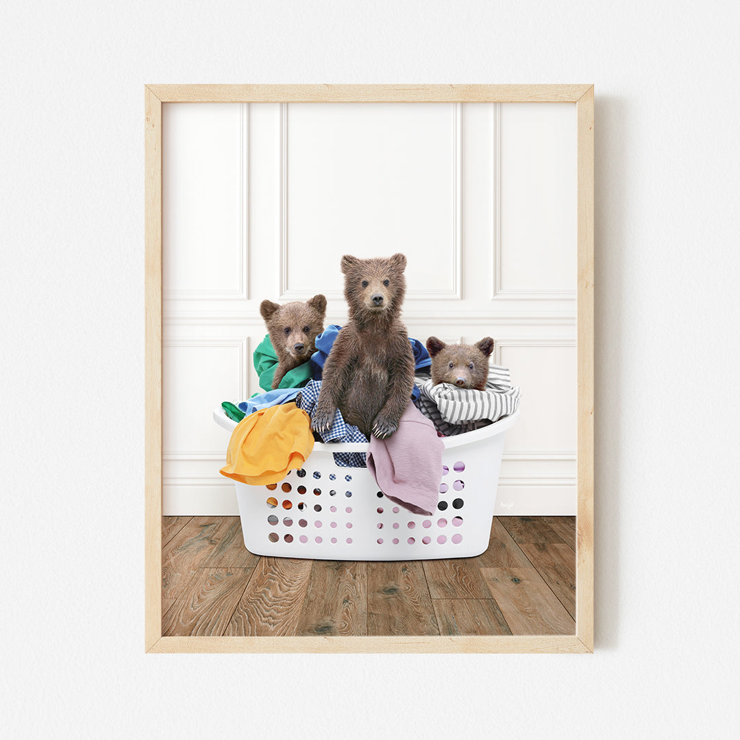 a group of bears sitting in a laundry basket