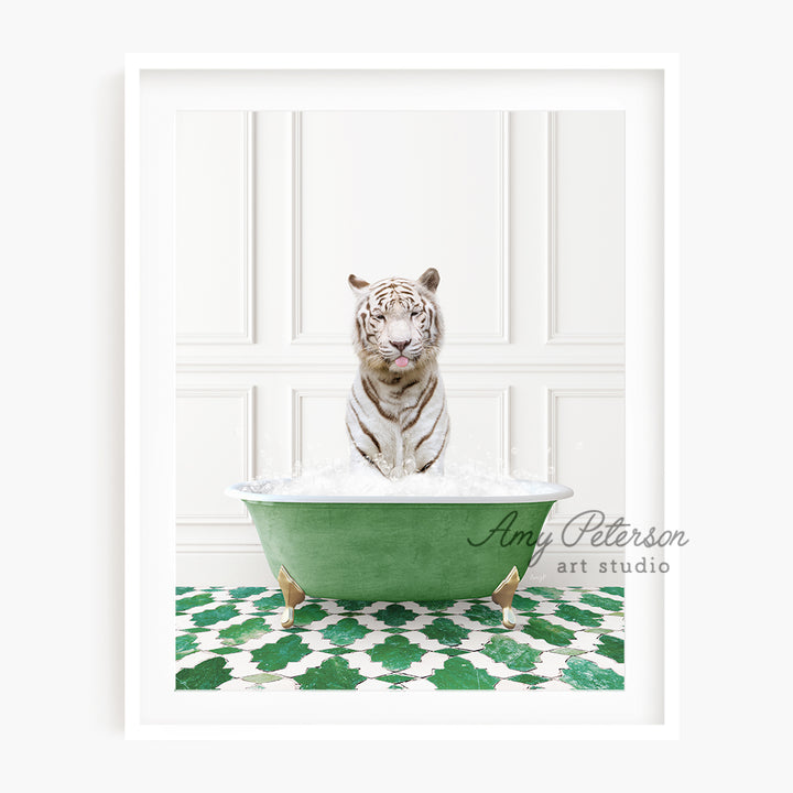 a white tiger sitting in a green bath tub