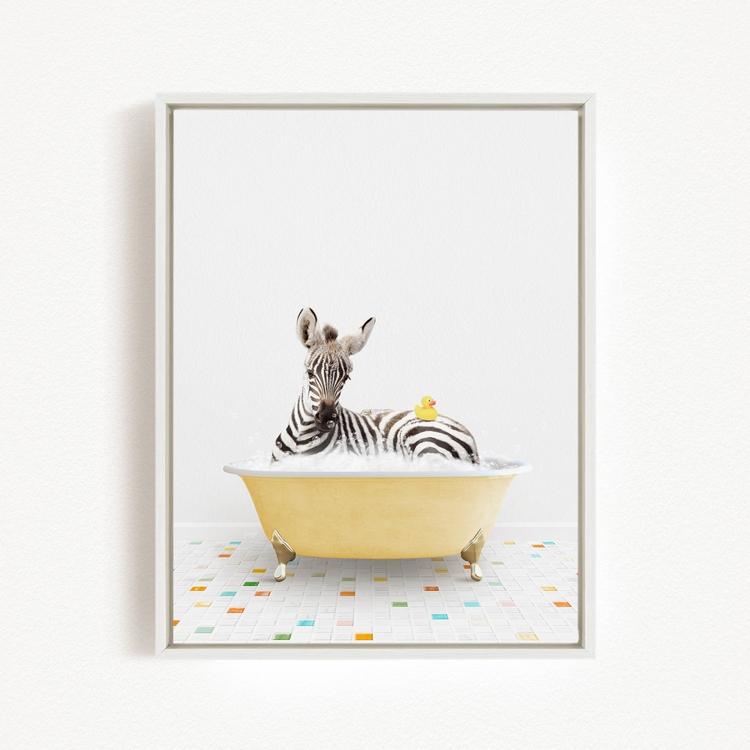 A zebra is sitting in a yellow bathtub filled with water, with a rubber duck floating on the water's surface.