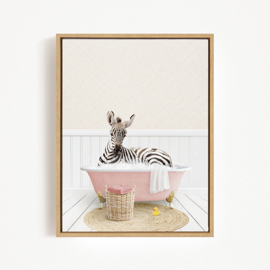 A zebra is sitting in a pink bathtub, surrounded by a basket of toys and a yellow rubber duck, creating a whimsical and playful scene.