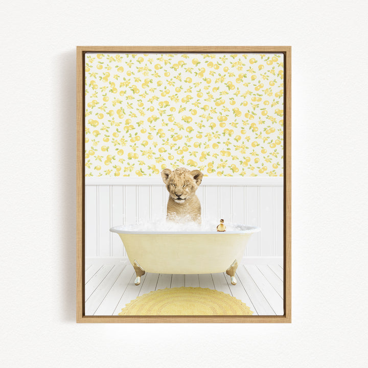 A young lion cub is sitting in a bathtub filled with bubbles, surrounded by a yellow and white floral wallpaper.