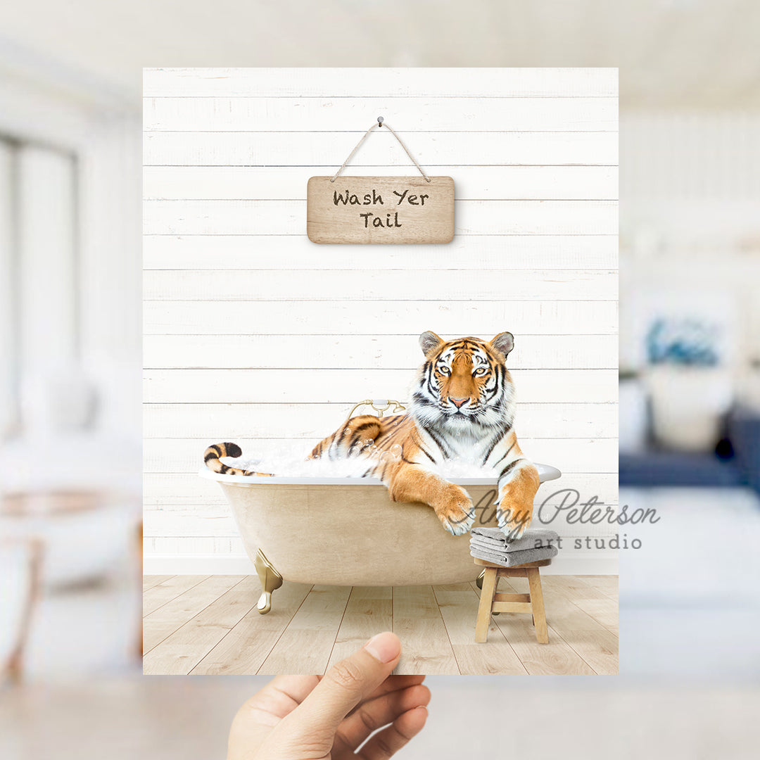 a hand holding up a picture of a tiger in a bathtub