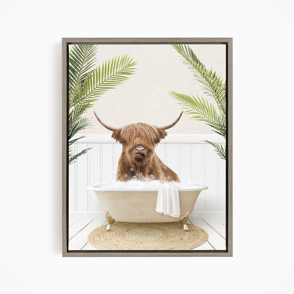 A brown cow with long horns is sitting in a white bathtub filled with bubbles, surrounded by green palm leaves.