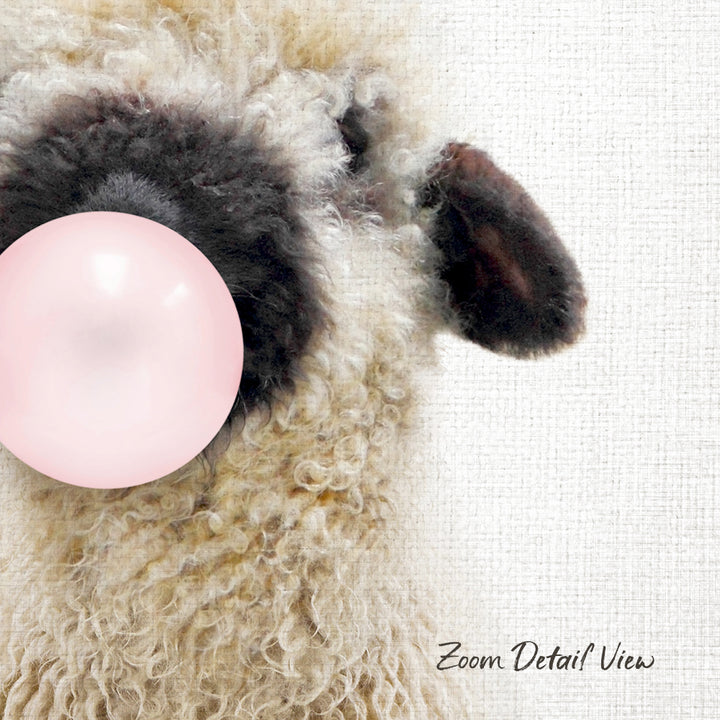 A close-up of a fluffy, furry animal, possibly a sheep or a lamb, with a pink bubble or balloon sticking out of its head.