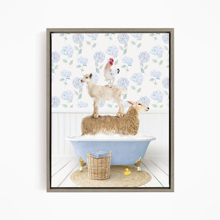A framed image depicting a sheep standing on a tub filled with bubbles, with a chicken perched on top of it, and a rooster sitting on the sheep's back.