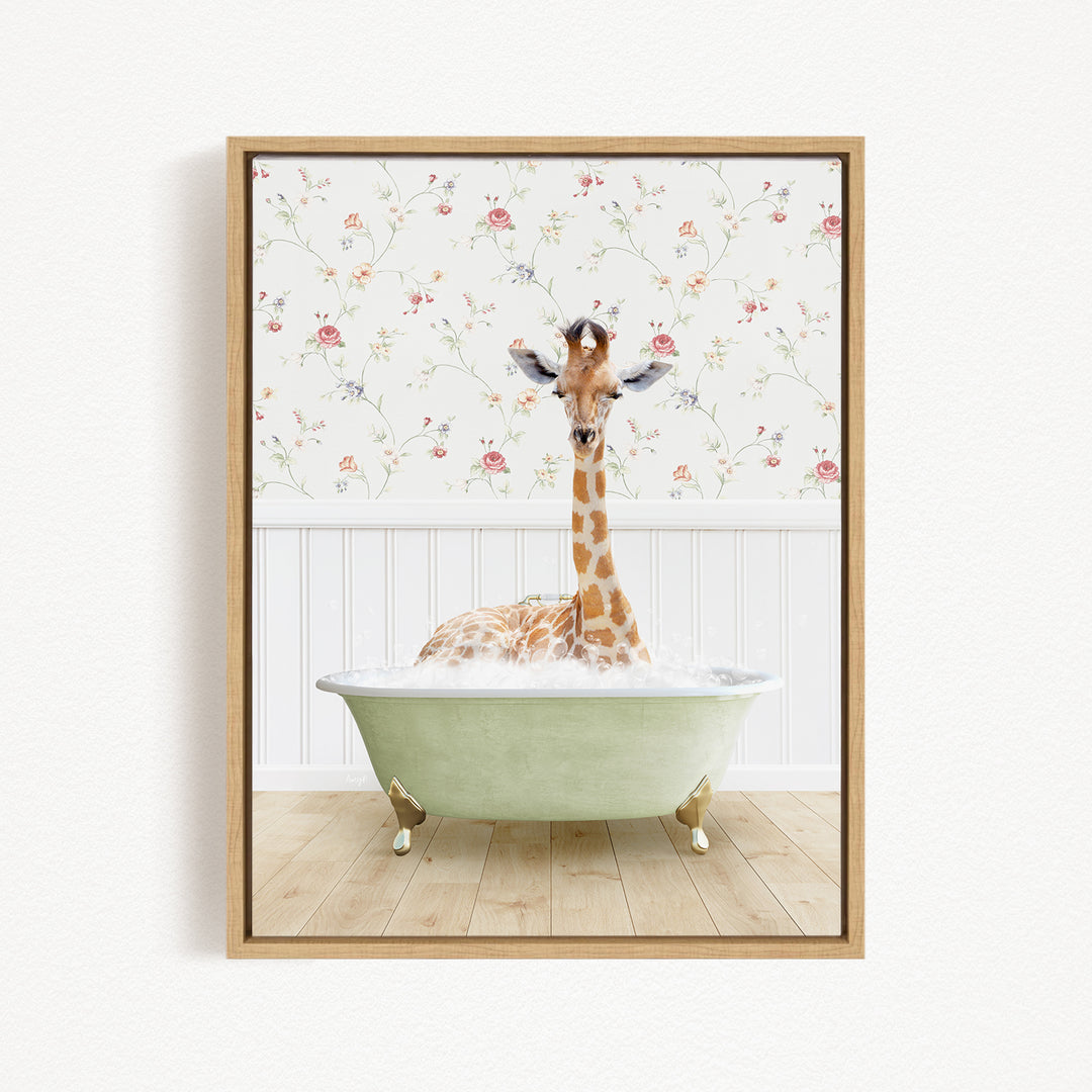 A giraffe sitting in a green bathtub filled with bubbles, surrounded by a floral wallpaper.