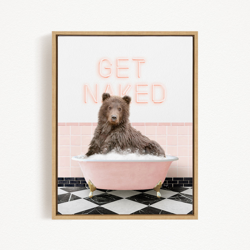 A brown bear sitting in a pink bathtub with the text "GET NAKED" displayed above it.
