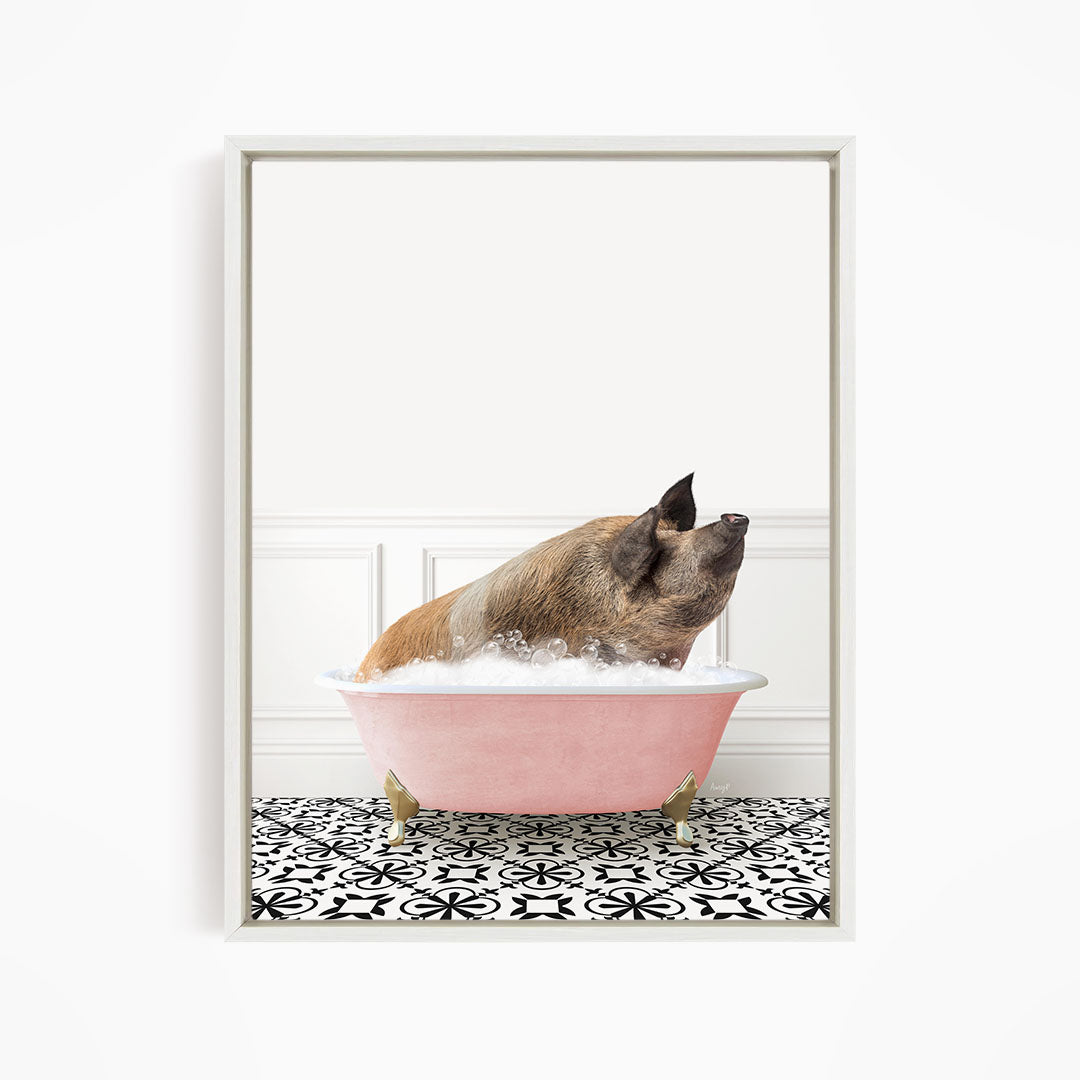 A pig sitting in a pink bathtub filled with bubbles, looking up at the camera.