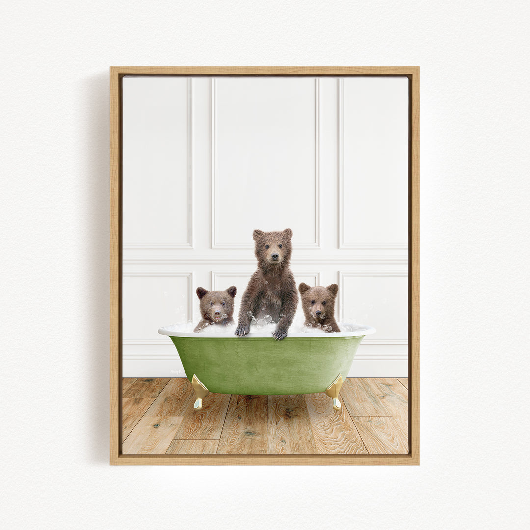 A framed image depicting three brown bears sitting in a green bathtub, with one bear standing and the other two sitting.
