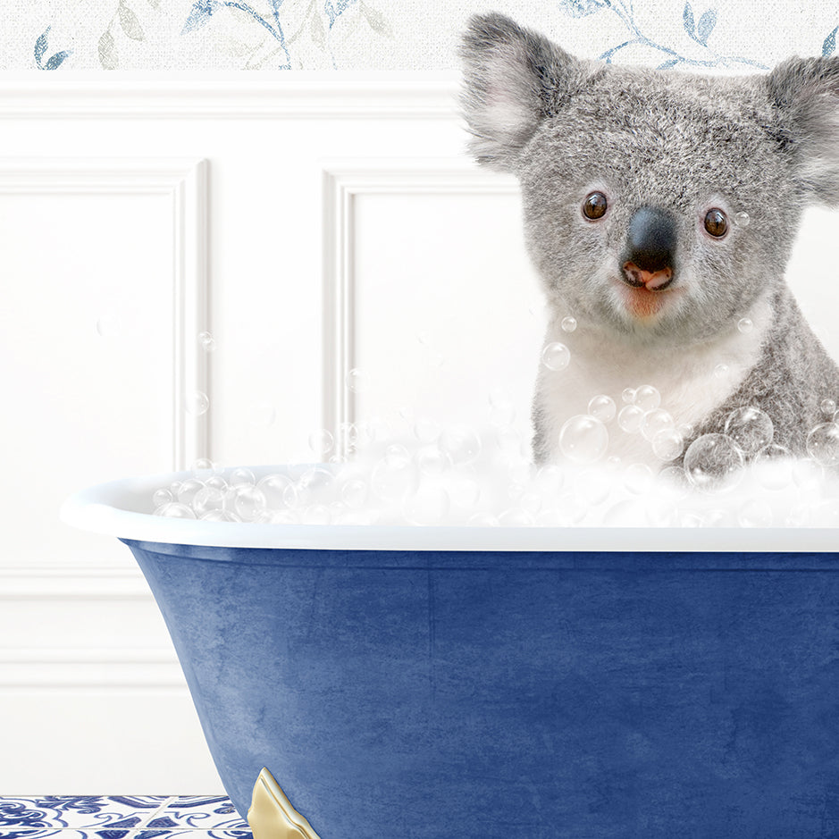 a koala is sitting in a bathtub with bubbles