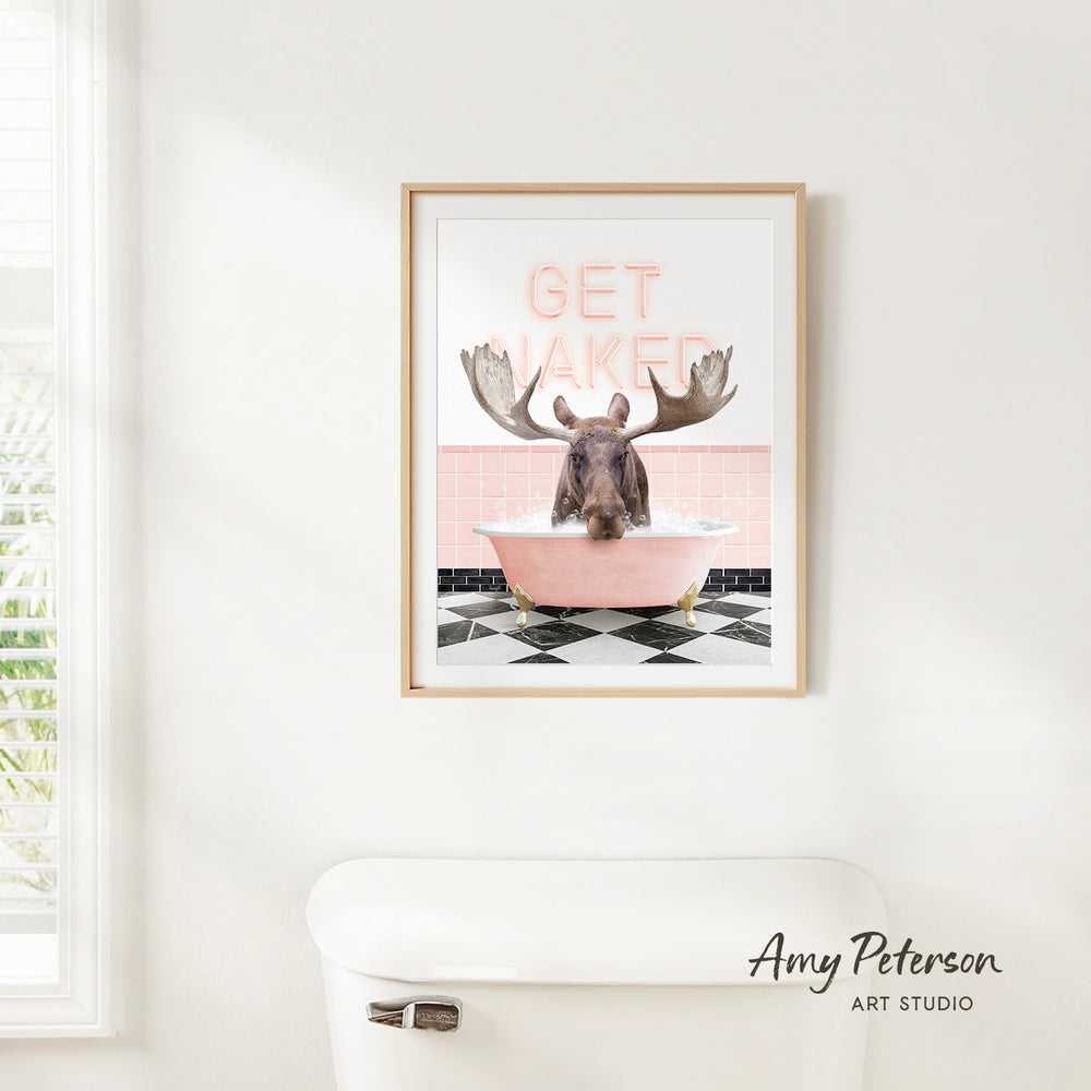 A framed poster with a moose sitting in a pink bathtub, with the text "GET WAKEED" written above it.