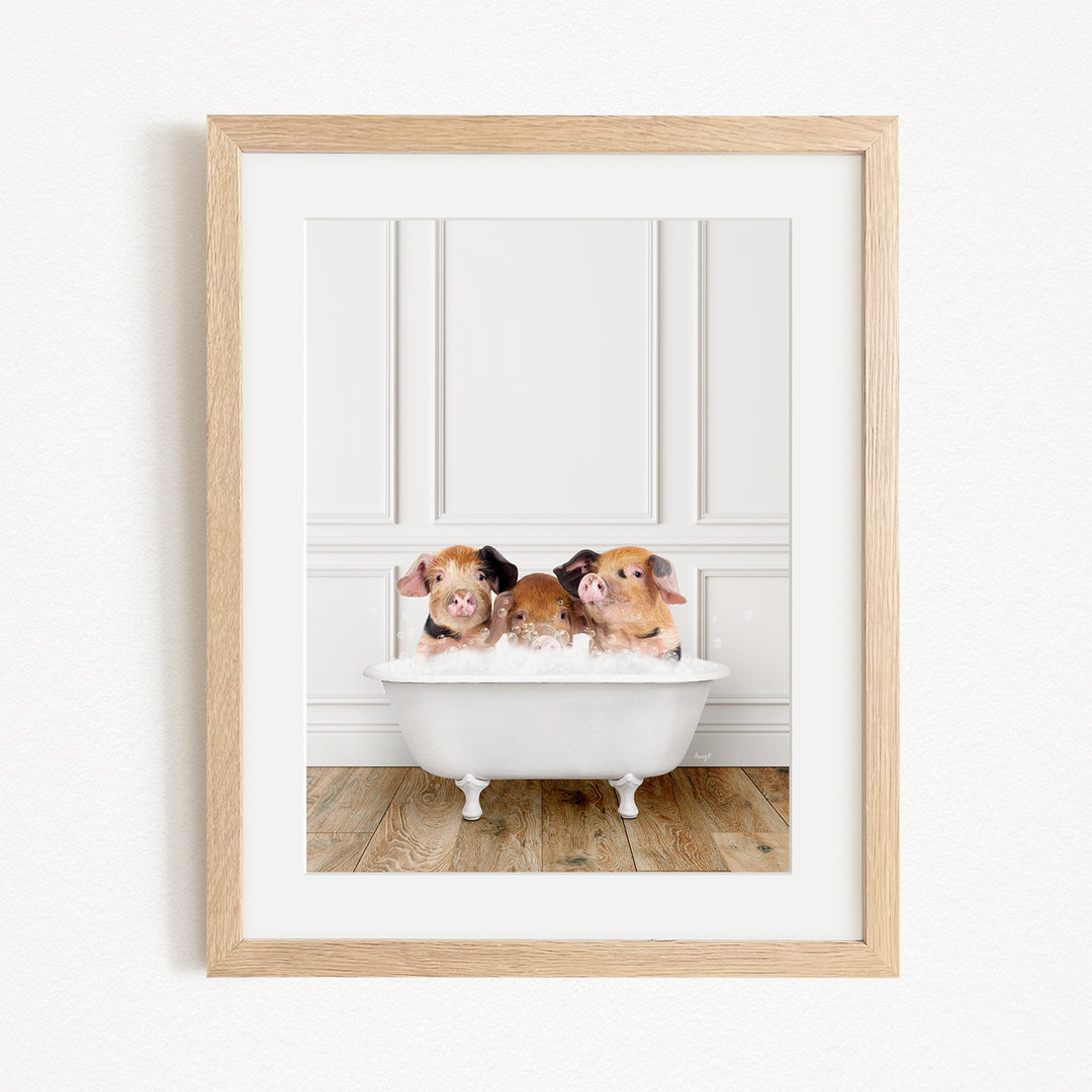 Three adorable pigs sitting in a white bathtub, enjoying a relaxing bath.