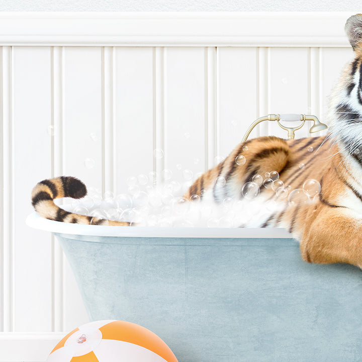 a tiger sitting in a bathtub with bubbles coming out of it