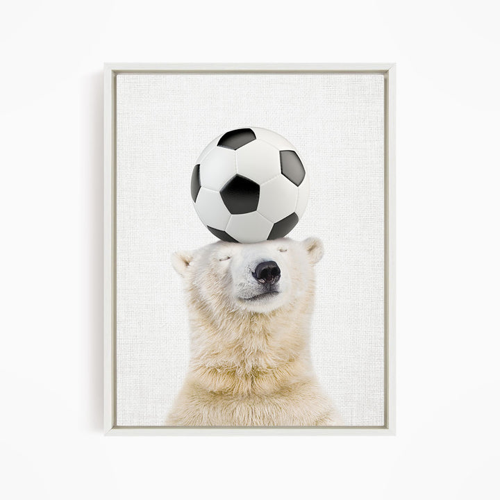 A polar bear balancing a soccer ball on its head.