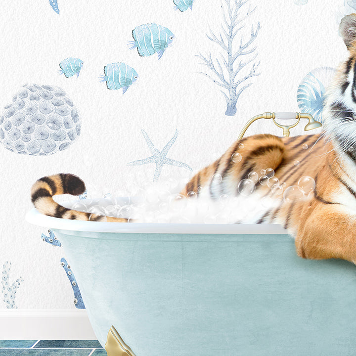 a stuffed tiger sitting in a bath tub