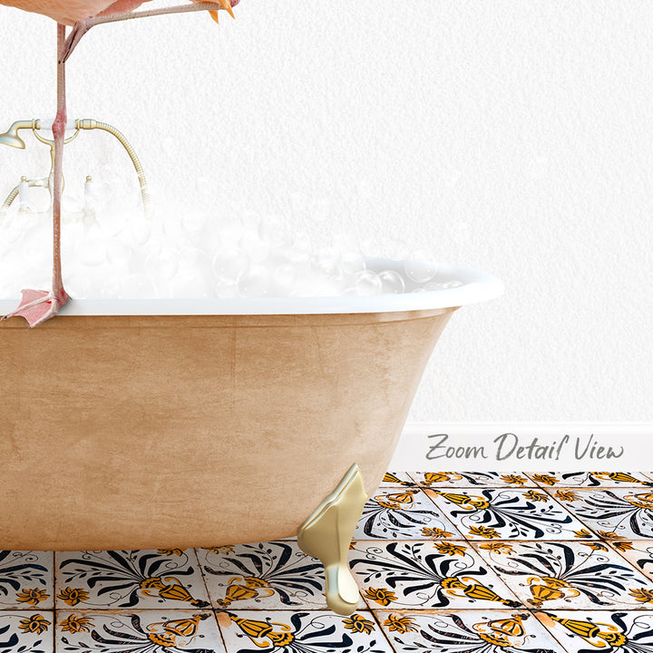 A clawfoot bathtub filled with water and bubbles, with a decorative tile floor featuring a floral pattern.
