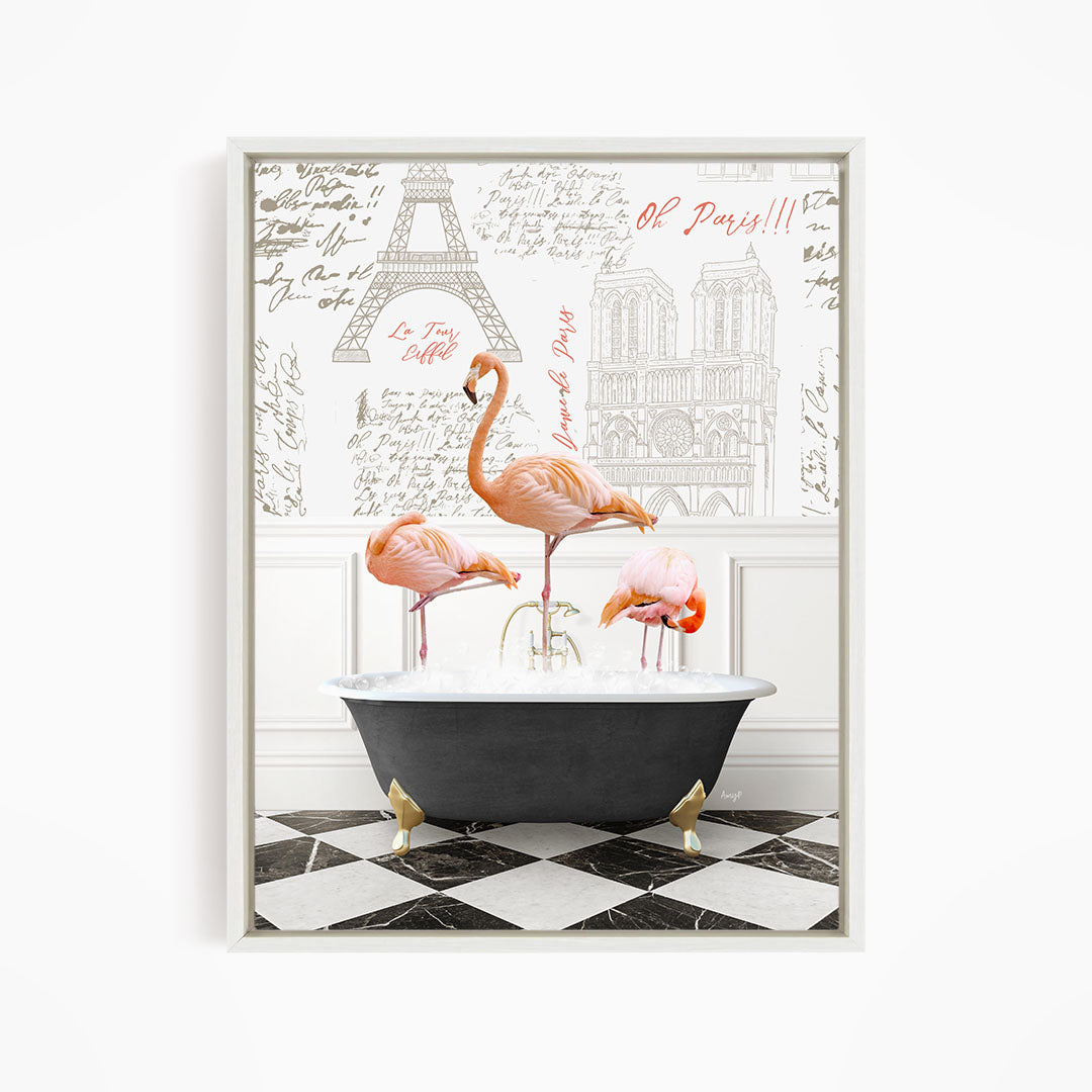A framed image depicting three flamingos standing in a bathtub, with a Paris-themed background featuring the Eiffel Tower and other Parisian landmarks.
