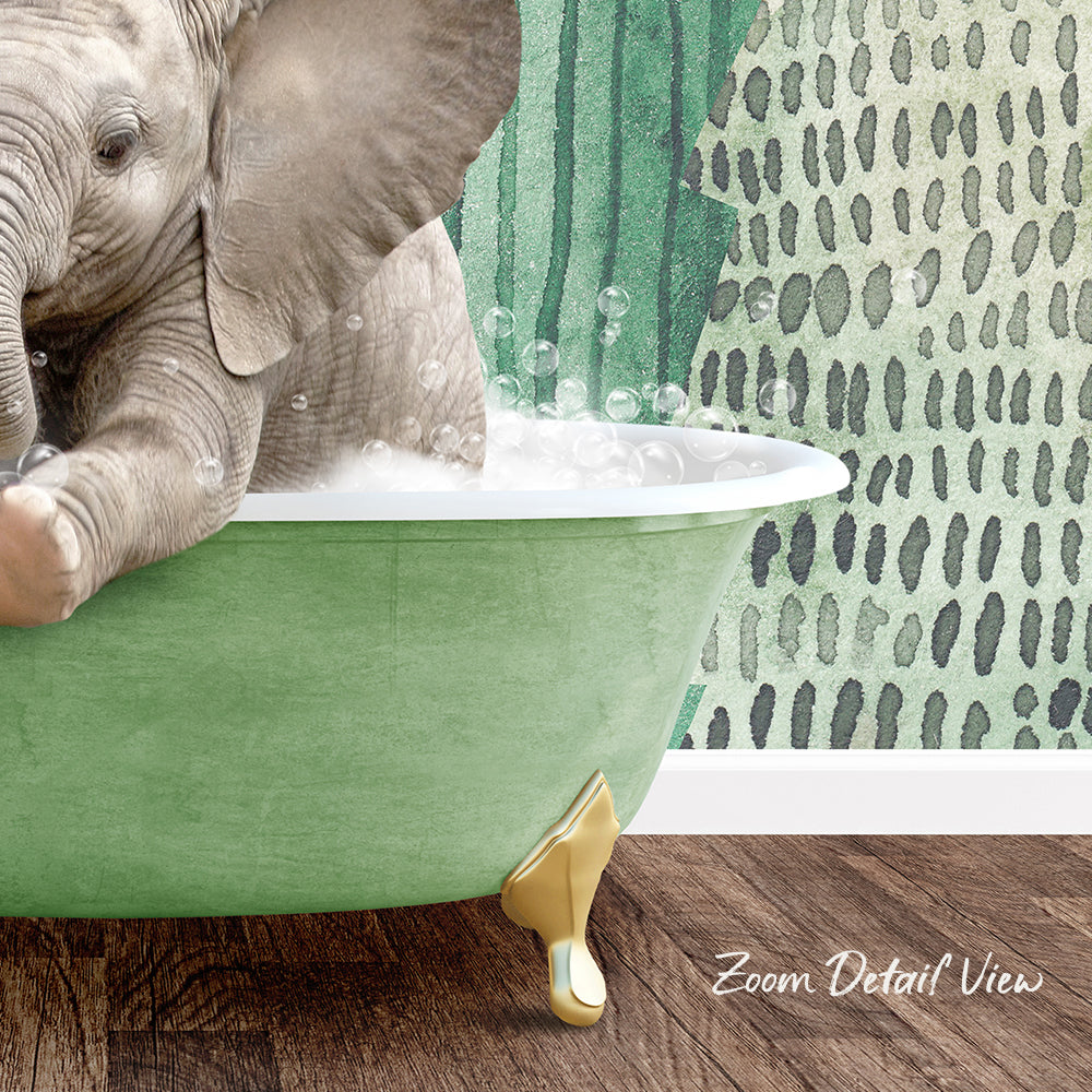 A baby elephant sitting in a green bathtub filled with bubbles, with a patterned wall in the background.