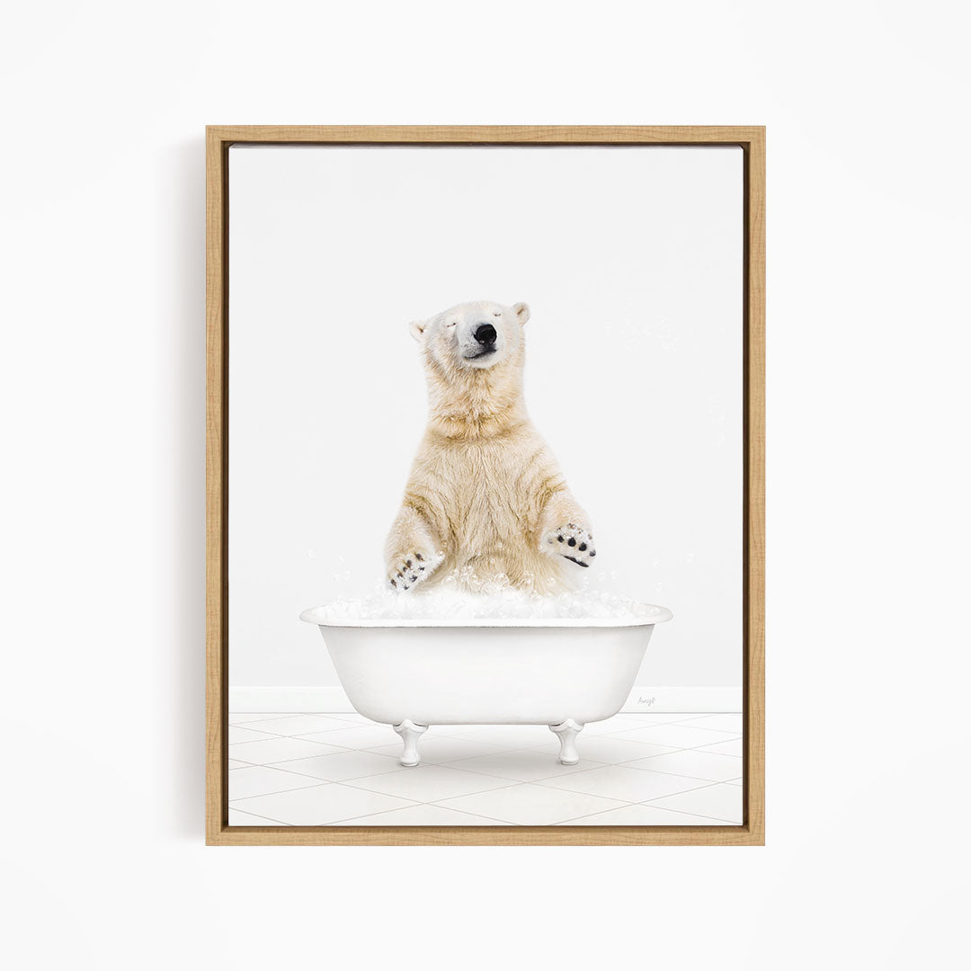 A polar bear standing in a white bathtub filled with water, appearing to be enjoying a bath.