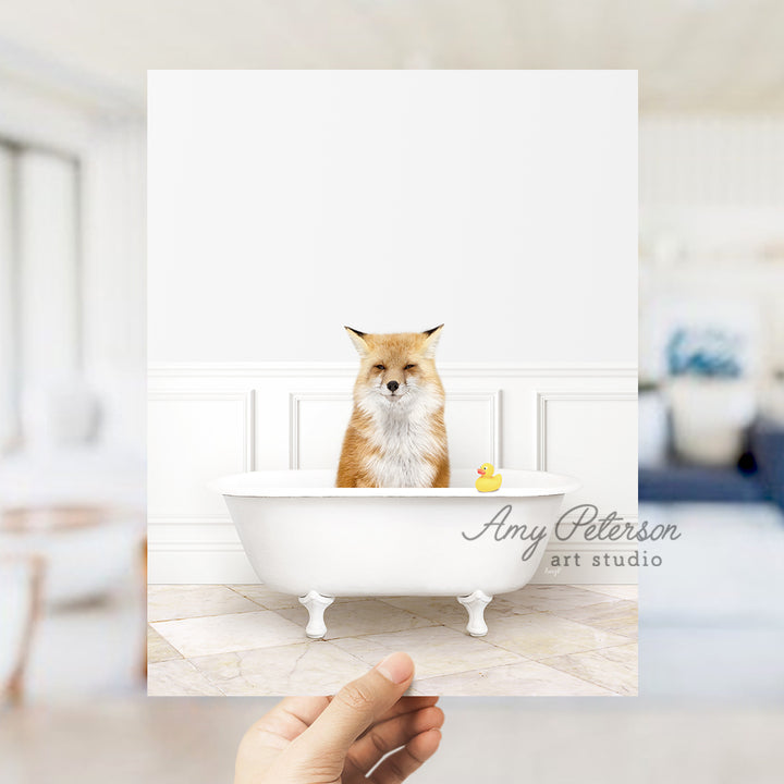 a person holding up a card with a picture of a fox in a bathtub