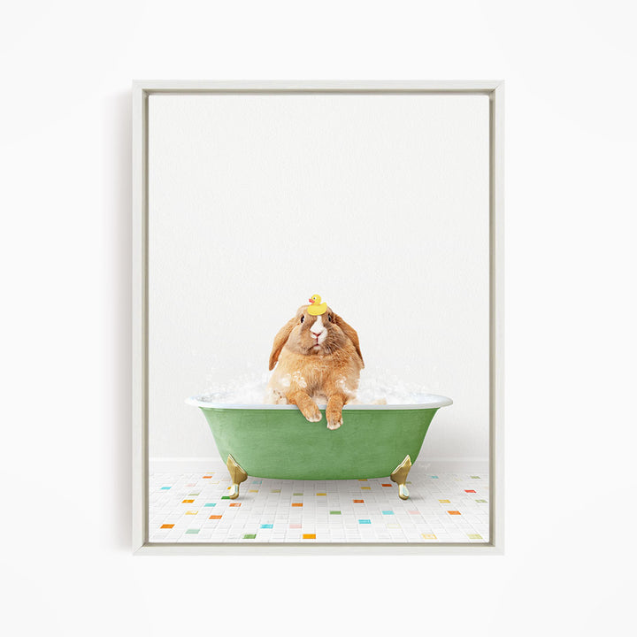 A brown rabbit sitting in a green bathtub filled with bubbles, wearing a yellow rubber duck hat.