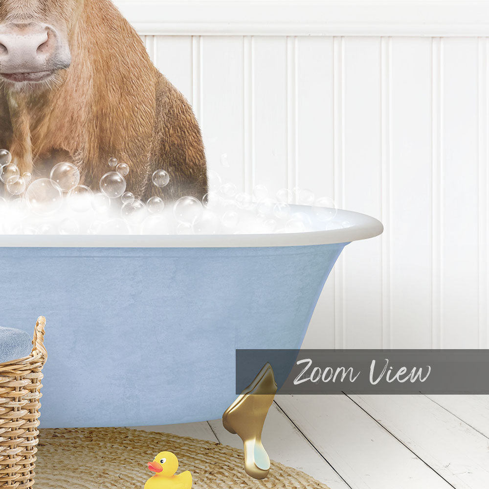 A brown cow is standing in a blue bathtub filled with bubbles, with a yellow rubber duck nearby.