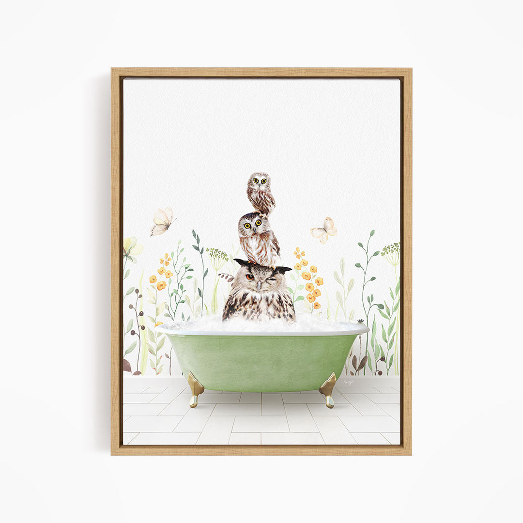 A framed illustration depicting a cat sitting in a green bathtub filled with water, surrounded by flowers and butterflies.