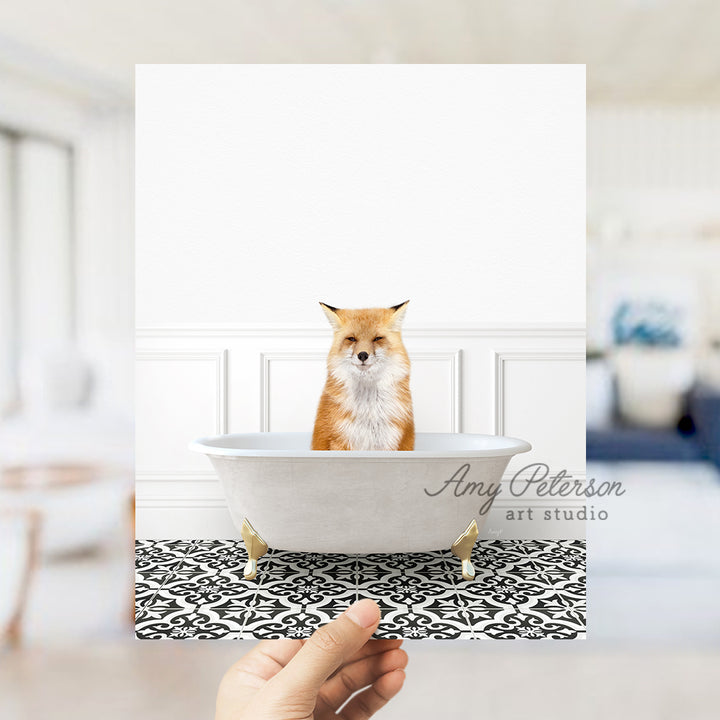 a person holding a card with a picture of a fox in a bathtub