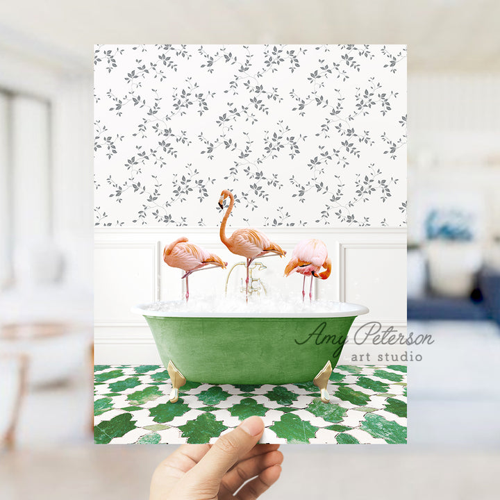 a person holding up a card with flamingos in a bathtub