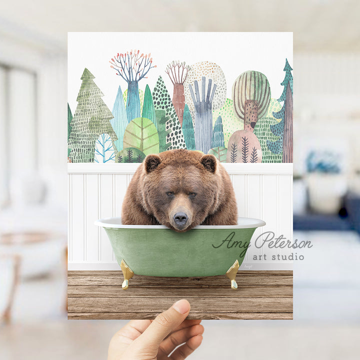 a hand holding up a card with a bear in a bowl