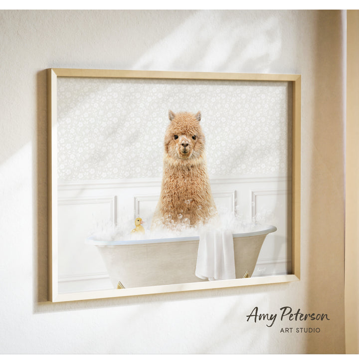 A brown alpaca sitting in a bathtub filled with bubbles, with a yellow duck floating nearby.