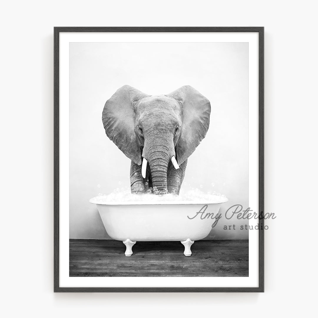 a black and white photo of an elephant in a bathtub